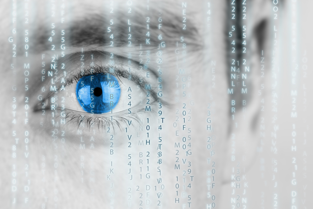 Futuristic image with human eye with blue iris and matrix texture surveillance