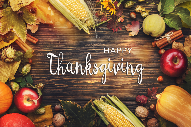 'Happy Thanksgiving' on Wooden Background with Autumn Fruits and Vegetables