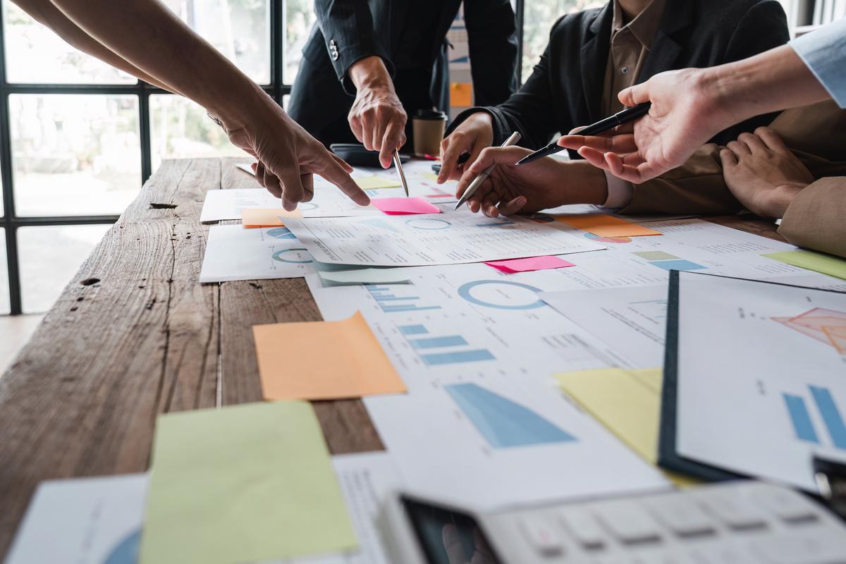 People working with documents on a desk