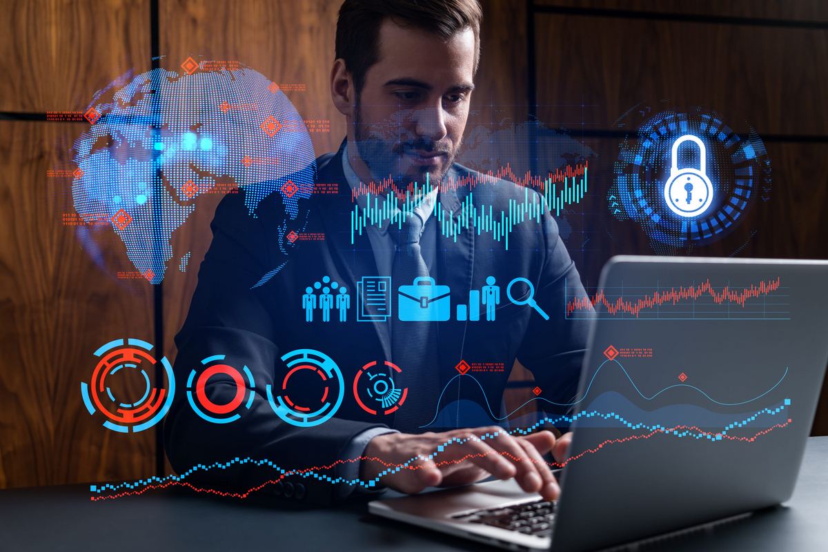 Business professional reviewing analytics dashboards on a laptop, with charts, network mapping, and security indicators overlaid.