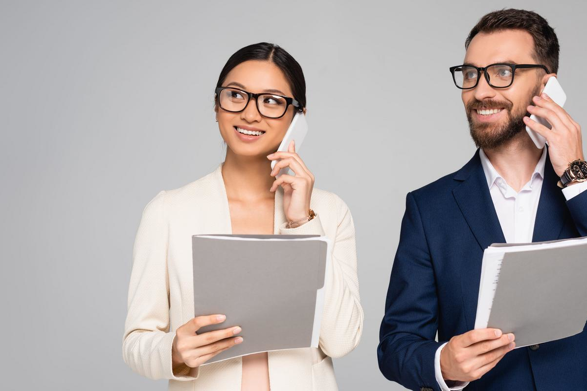 Business people talking on mobile phones