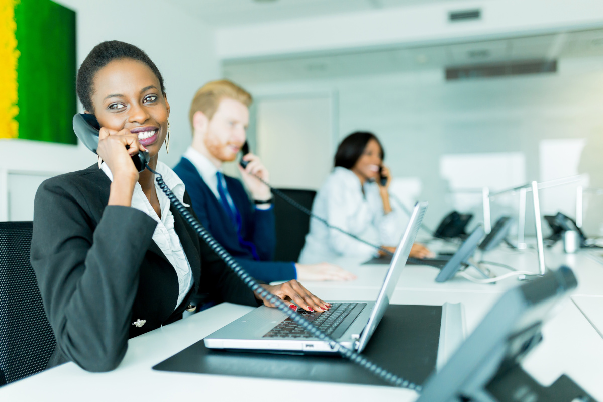 A call center with employees answering their work phones