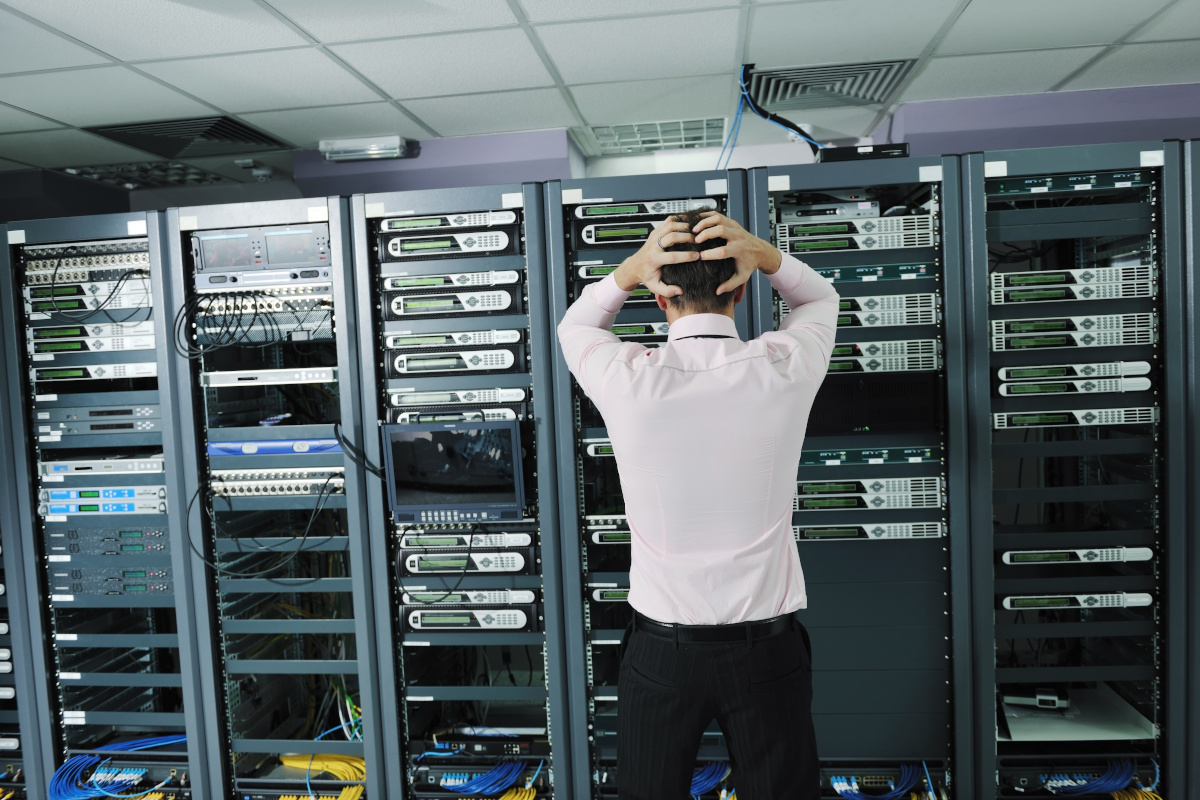 Frustrated Man looking at Network Servers
