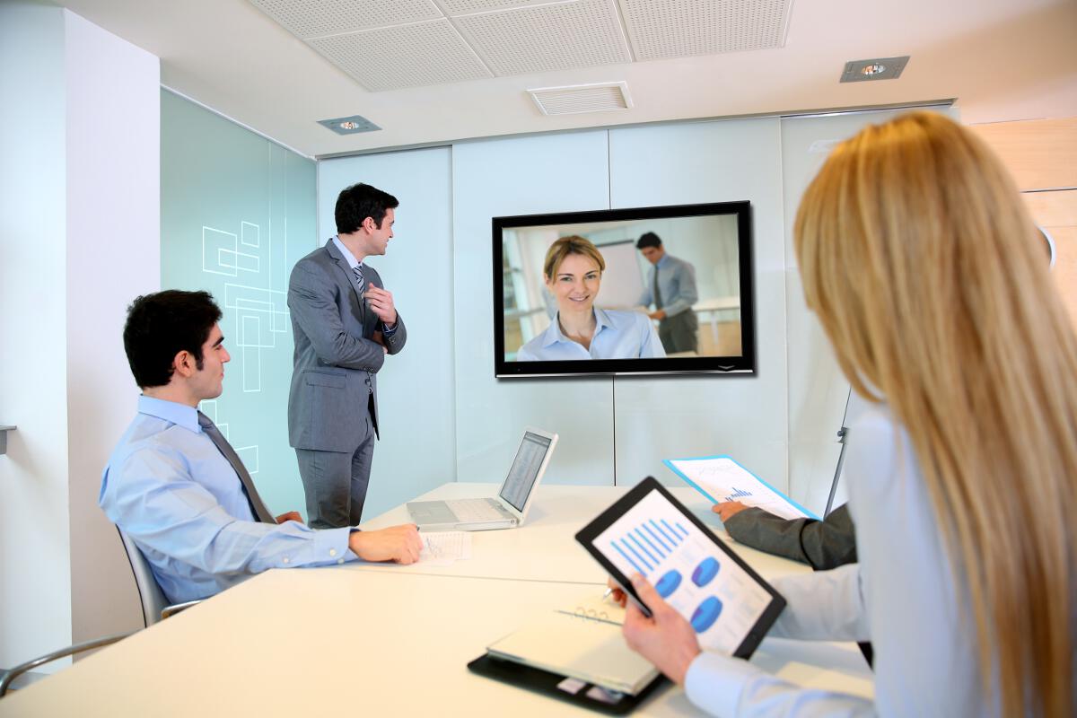 A room of people displaying Video-Conferencing as a Service