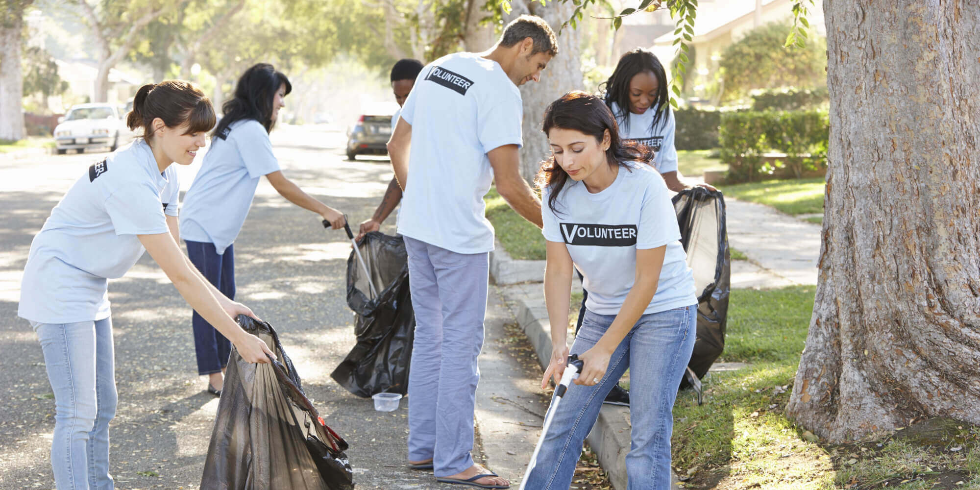 Volunteers cleaning up a community street